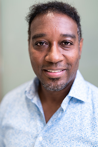 Image of a man wearing polo wearing a beautiful smile